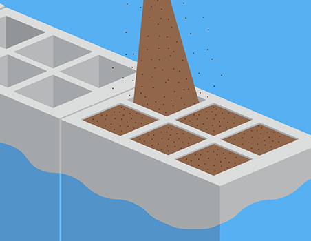 ケーソンの中に砂を投入する